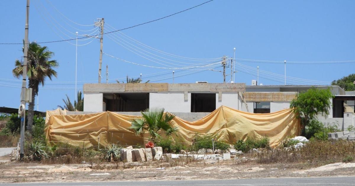 A newly built villa standing on protected coastal land at Armier, Mellieħa, in northern Malta.