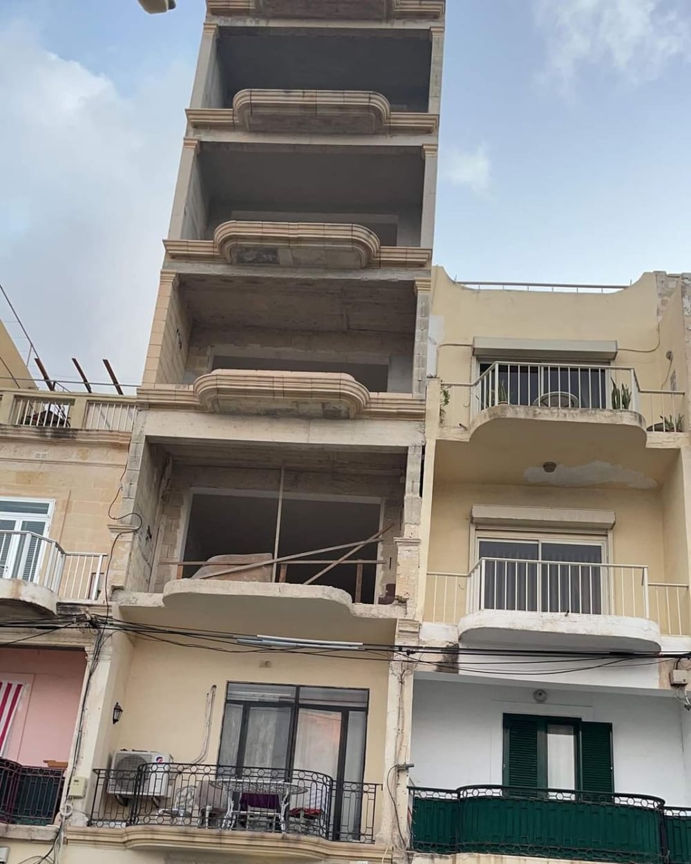 An apartment block under construction on a corner